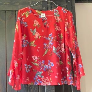 Red, flowered blouse